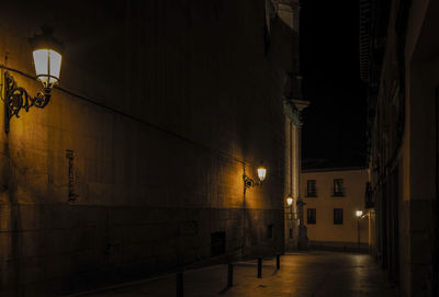 City street at night with light of street lamps at night. shot in madrid, spain