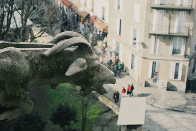 Close-up of animal statue against building