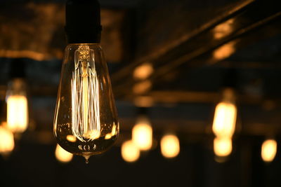 Close-up of illuminated light bulb