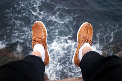 Low section of person wearing shoes