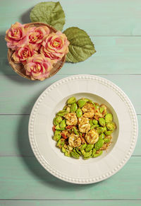 High angle view of roses in plate on table