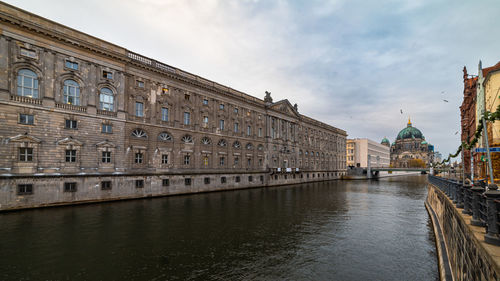 Canal amidst buildings in city