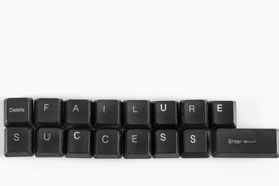 Close-up of computer keyboard against white background