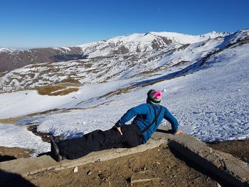 Full length of man on snowcapped mountains against sky