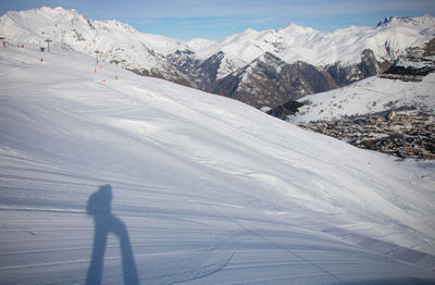 People skiing on snowcapped mountain