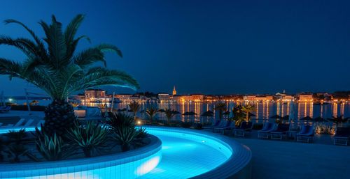 View of swimming pool at night