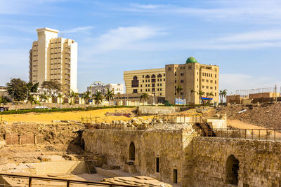 Buildings in city against sky