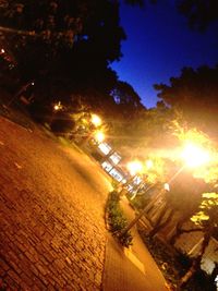 Low angle view of illuminated building against sky