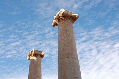 Low angle view of column against sky