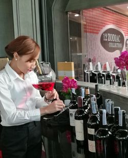 Girl sitting on table in restaurant