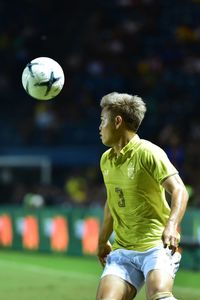 Low angle view of man playing soccer ball