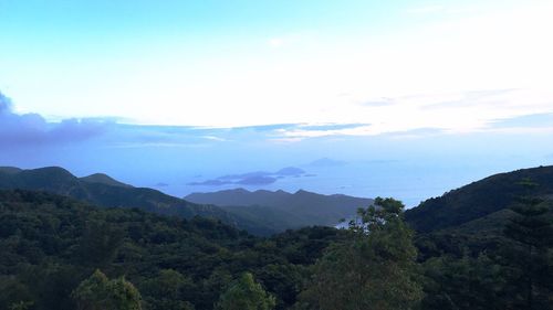 High angle view of mountains against cloudy sky