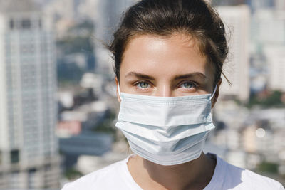 Portrait of young woman wearing mask