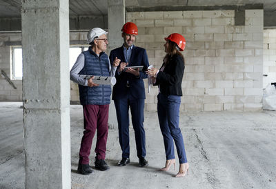 Engineers brainstorming at construction site