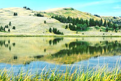 Scenic view of lake with mountain in background