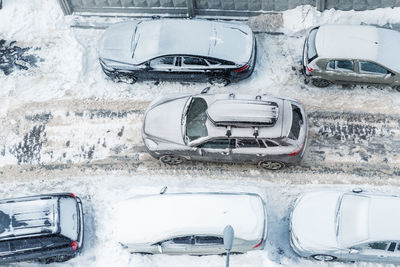 Aerial view of cars on snow covered road during winter