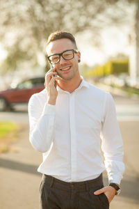 Full length of young man using smart phone