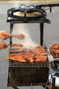 Close-up of meat cooking on barbecue grill