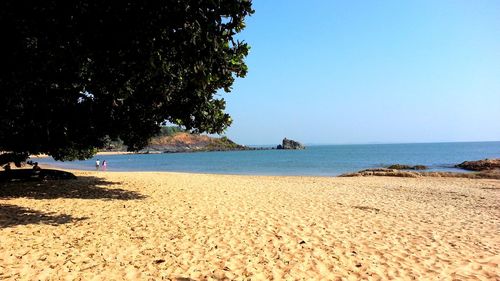 Scenic view of beach against clear sky