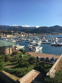 Boats moored at harbor