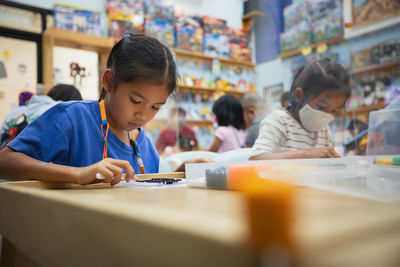 Female students doing activity in school