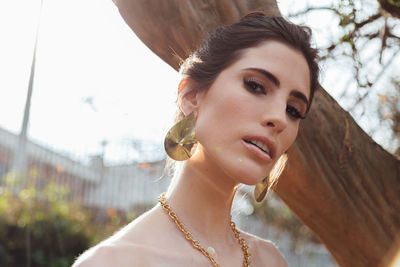Portrait of beautiful young woman outdoors