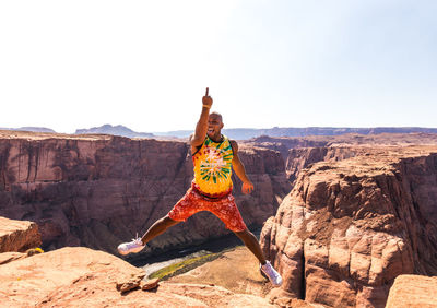 Rock formations on landscape against sky