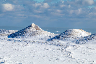 Scenic view of sea against sky during winter