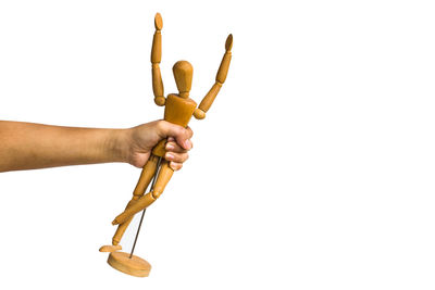 Close-up of man holding hands over white background