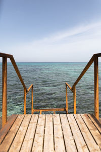 Pier over sea against sky