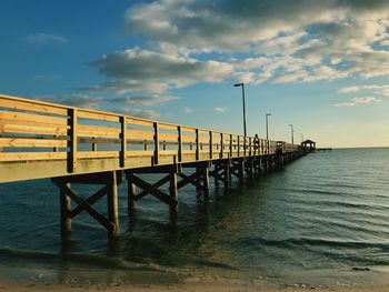 Pier over sea against sky