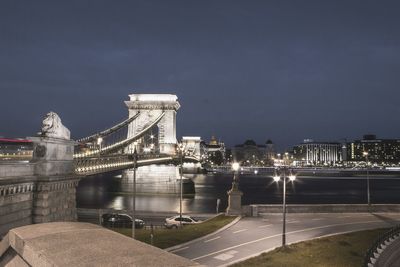 Bridge over river at night