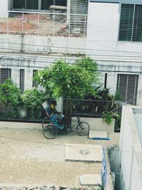 Bicycle on street against buildings in city