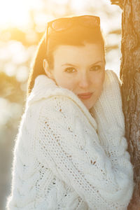 Portrait of woman with ice cream in winter