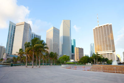 Skyscrapers in city against sky