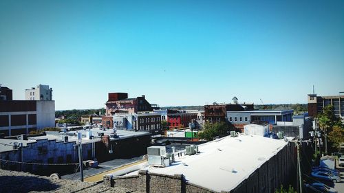 Panoramic view of residential district against clear blue sky