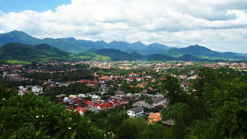 High angle view of houses and mountains against sky