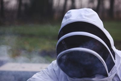 Close-up of beekeeper wearing costume