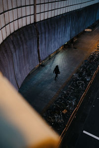 High angle view of man walking in water