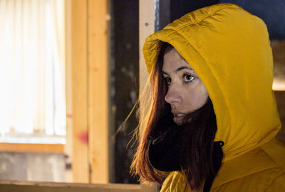 Portrait of young woman looking away