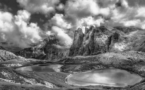 Scenic view of mountains against cloudy sky