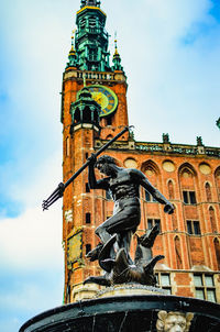 Low angle view of statue against sky