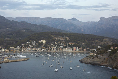 High angle view of townscape and mountains against sky