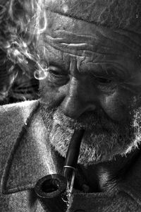 Close-up of senior man smoking