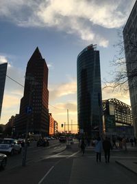 Modern buildings against cloudy sky