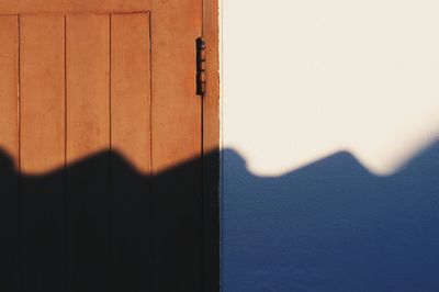 Close-up of open door of house