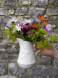 Close-up of hand holding bouquet