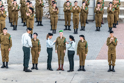 Group of people standing in row