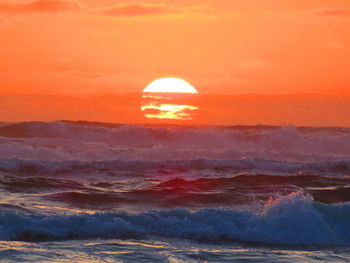 Scenic view of sea at sunset