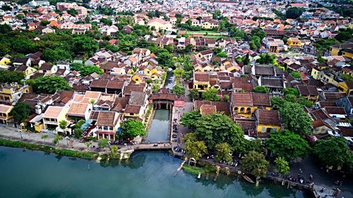 High angle view of townscape and river in town